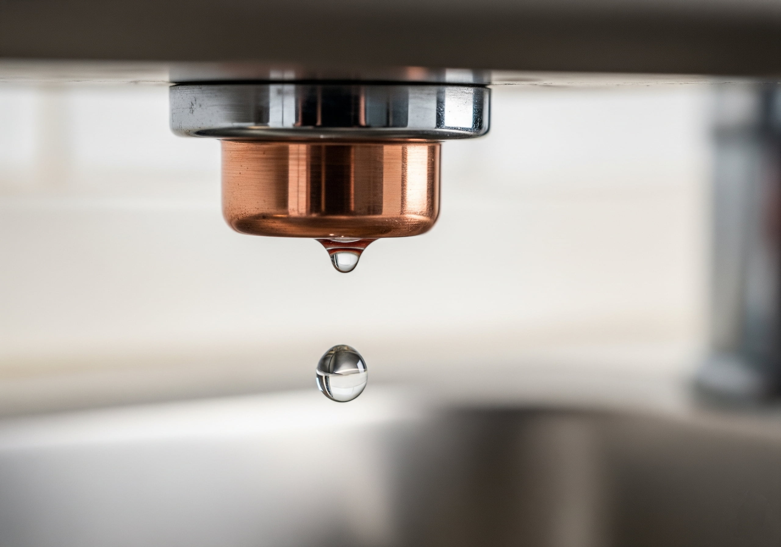 A leaking pipe under a kitchen sink